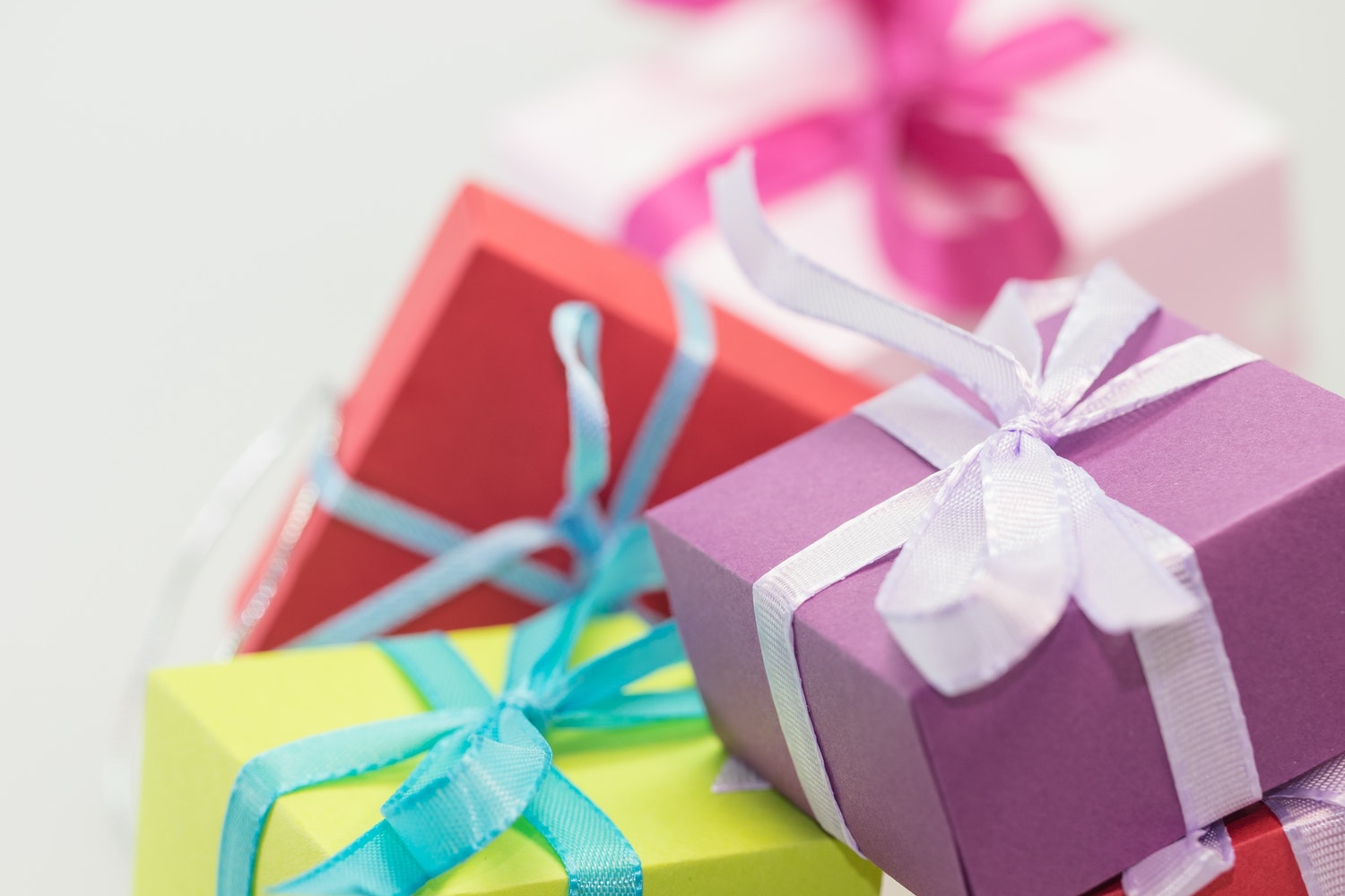 Colourful Gift Boxes Close up with Blurred White Background