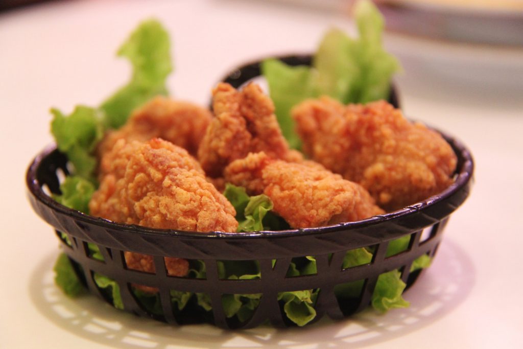 Cooked Fried Chicken Legs on Green Leaf Salad