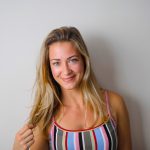 Profile of Blonde Woman in Striped Top on White Background