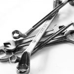 Assortment of Chrome Spanner Tools on White Background