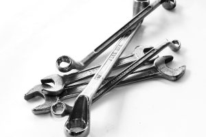Assortment of Chrome Spanner Tools on White Background