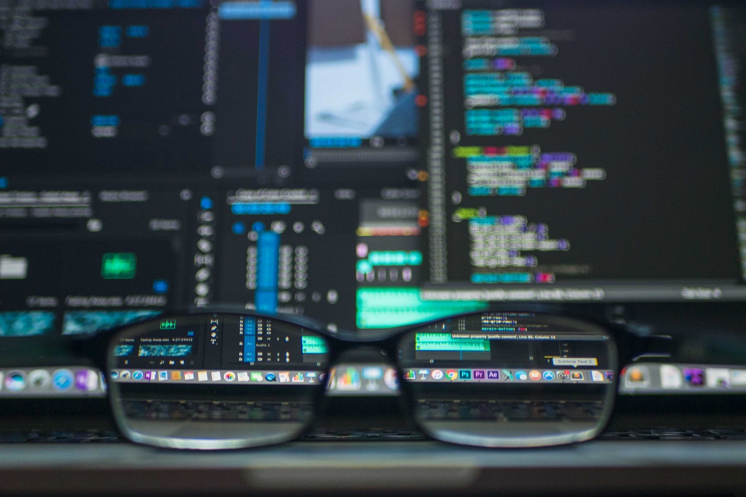 Blurred Computer Code Shown Clearly Through Glasses